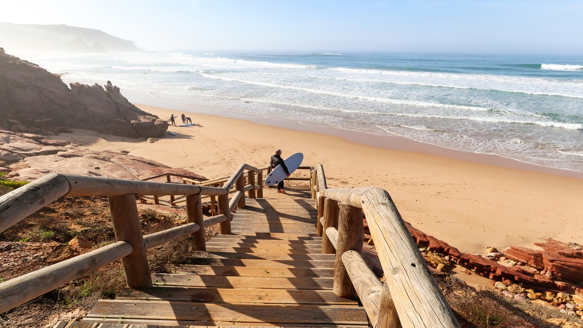 wooden stairs leading down to beautiful isolated beach perfect for surfers