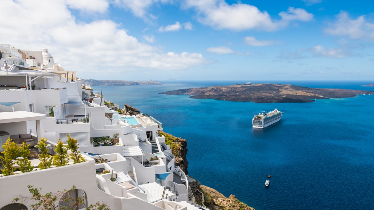 iconic white villas in Santorini overlooking the Aegean Sea 